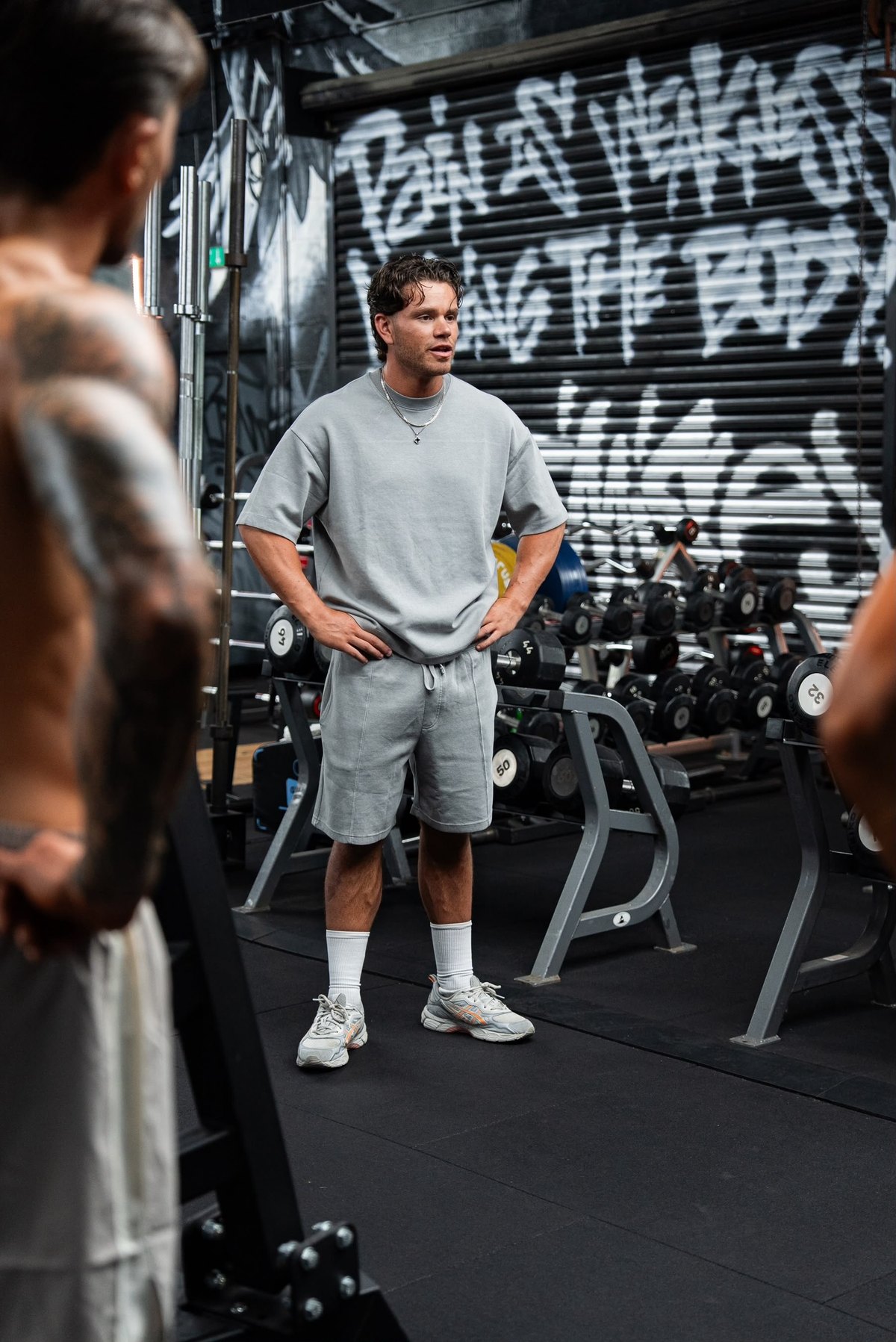Will, physique coach and founder of Echelon Coaching, coaching in the gym